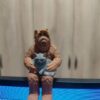ALF figurine holding a cat.