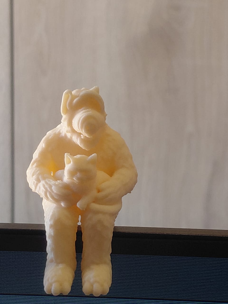 Alf figurine holding a cat.