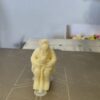 3D printed Alf holding a cat figure.