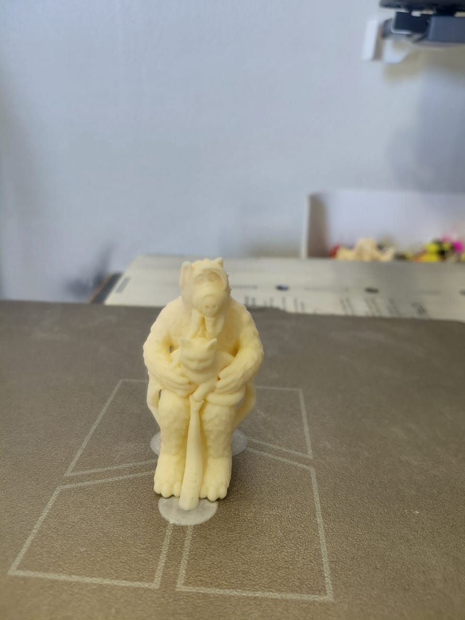 3D printed Alf holding a cat figure.