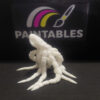 A white 3D printed articulated octopus model named Gary, shown from a side-angled perspective. The octopus is posed with its front tentacles lifted and curved, highlighting the multi-jointed articulation and matte white finish against a dark background.