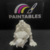 A front-facing perspective of a white 3D printed Sabertooth Tiger skeleton. The model is in a low prowling stance, showcasing the iconic long canine teeth, detailed skull, and wide paw structure.