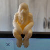 Chewbacca figurine sitting on a monitor's edge.