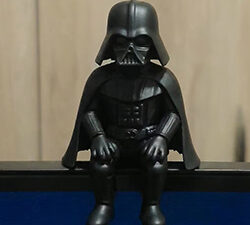 Darth Vader figurine sitting.
